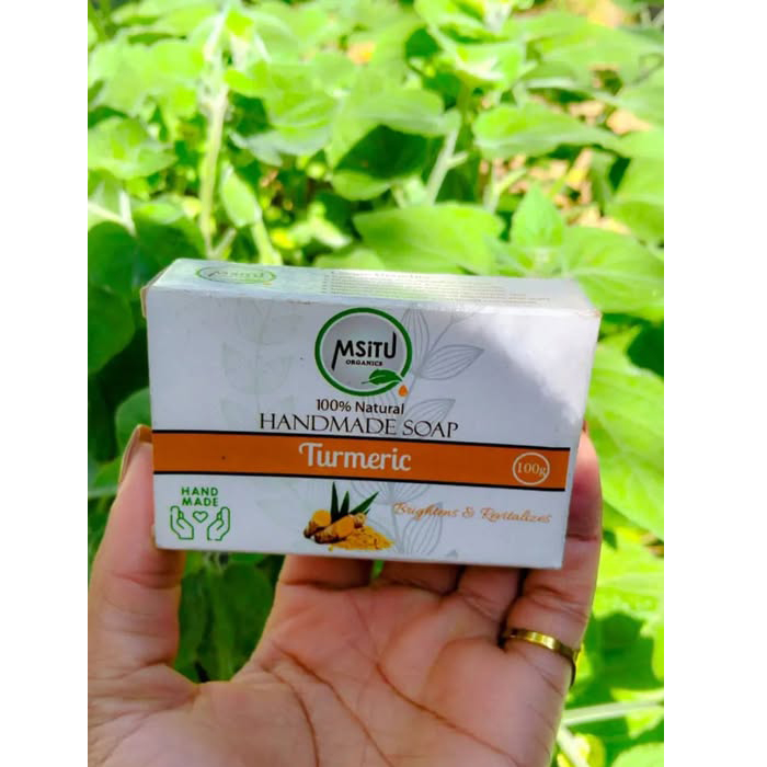Msitu Organics Turmeric Soap 100g Turmeric Soap is 100% Hand Made and Natural. Soap made for a Brightened glowing and even skin tone. Highlights Turmeric soap is a powerful antioxidant and anti-inflammatory which offers the following benefits: Brightens and revitalizes dull skin Helps reduce dark spots and blemishes Supports an even skin tone Soothes and calms the skin Best For: All skin types, especially dull or uneven skin